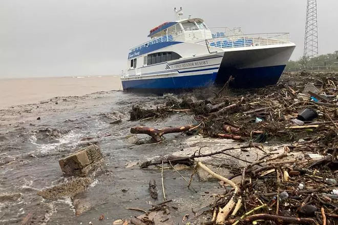 A boat lies washed up on shore after the passing of Hurricane Fiona in Ponce, Puerto Rico September 19, 2022. REUTERS