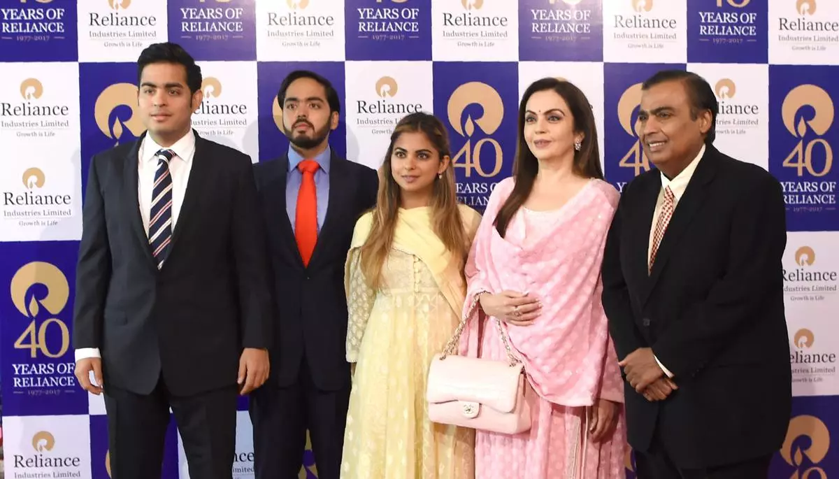 File photo: Mukesh Ambani (right), Chairman, Reliance Industries Limited with his wife Nita and three children Akash, Anant and Anant