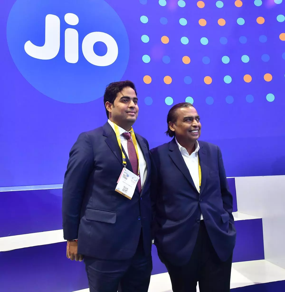 Reliance Industries Ltd Chairman Mukesh Ambani with his son Akash Ambani at Reliance Jio‘s stall during the inaugural ceremony of India Moblie Congress 2022, and launch of 5G services, at Pragati Maidan in New Delhi on Saturday, October 1, 2022. (SHIV KUMAR PUSHPAKAR/The Hindu)