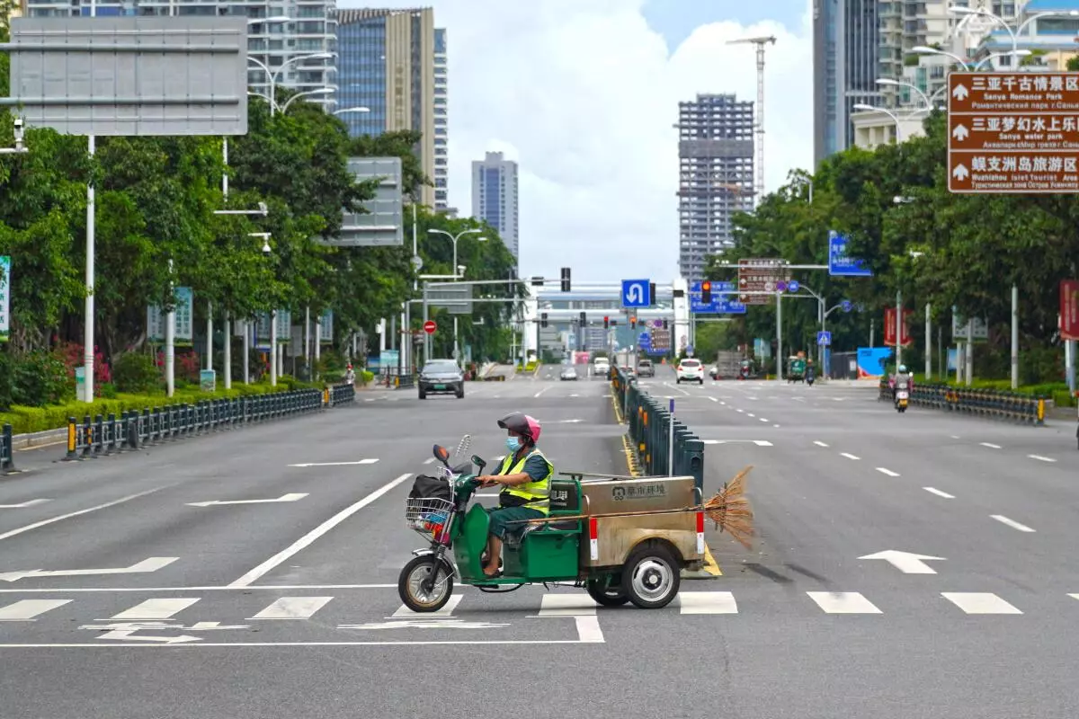 A sanitation worker drives past an intersection amid lockdown measures to curb the Covid-19 outbreak in Sanya, Hainan province, China August 6, 2022. (REUTERS)