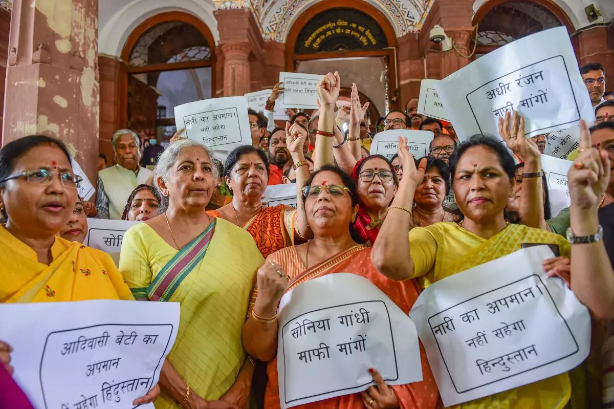 Union Finance Minister Nirmala Sitharaman with other BJP MPs during a protest against Congress leader Adhir Ranjan Chowdhury‘s remarks on President Droupadi Murmu, at Parliament House, in New Delhi, Thursday, July 28, 2022. (PTI)