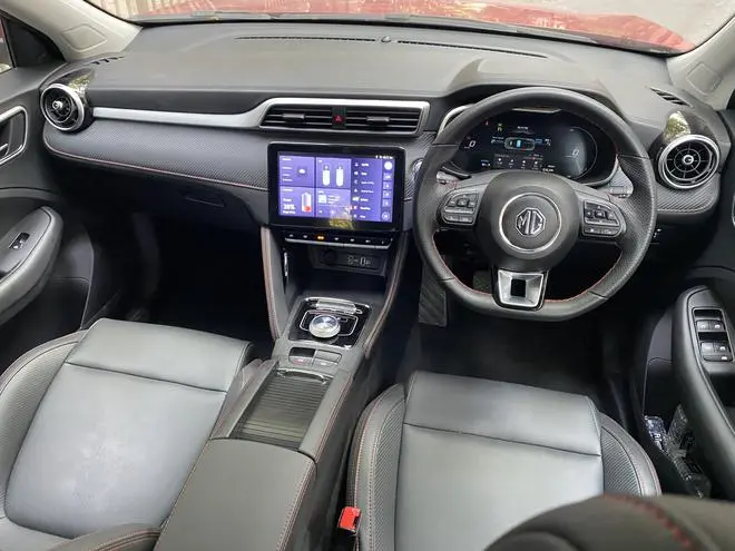 The stitched leather panels, the contrast stitched, leather-clad steering wheel and the similar treatment to the centre console are all quite striking The stitched leather panels, the contrast stitched, leather-clad steering wheel and the similar treatment to the centre console are all quite striking