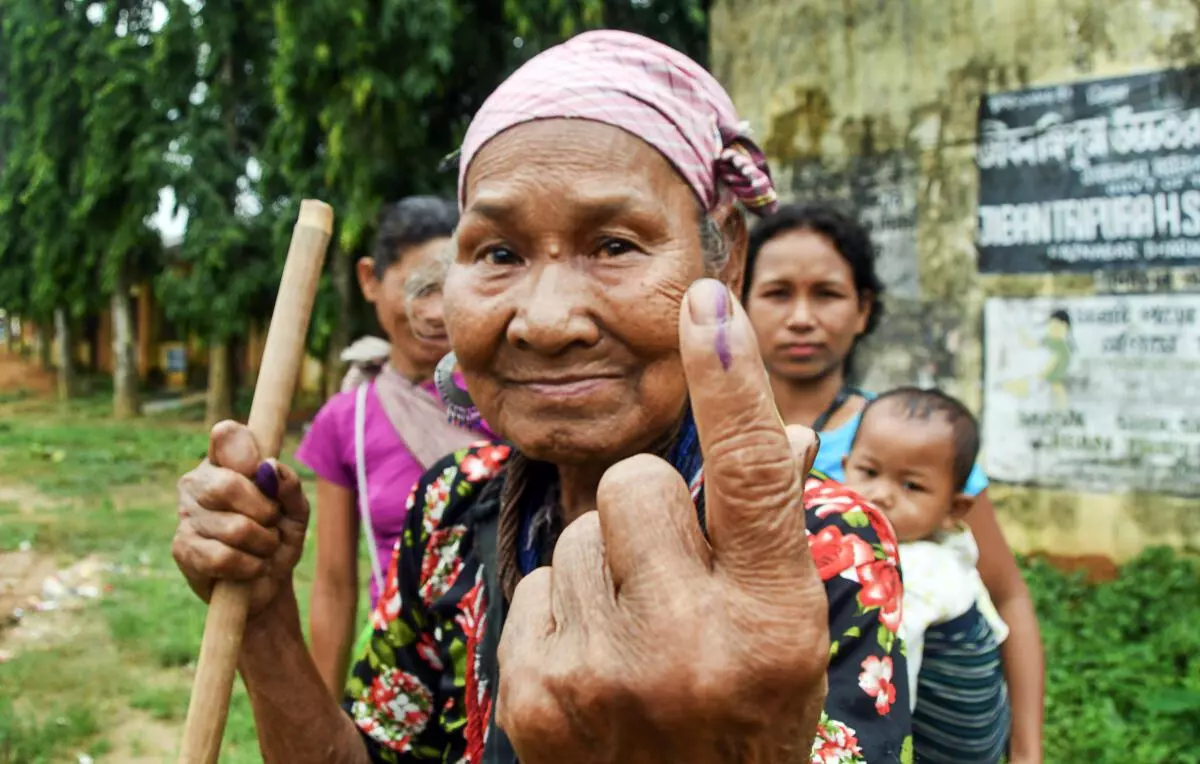 A Reang tribal woman shows her finger marked with indelible ink after casting vote during Assembly by-polls, at Aanndabazar in North Tripura district, Thursday, June 23, 2022. (PTI Photo)