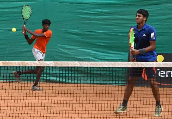 Rakshak Tarun (left) and Kavin Karthik in action against Denim Yadv and Vansh Nandal during the boys’ doubles final at the 29th National junior U-18 clay court tennis championship at the SDAT Stadium in Egmore, Chennai on August 19, 2022. (Photo: Jothi Ramalingam/THE HINDU) Rakshak Tarun (left) and Kavin Karthik in action against Denim Yadv and Vansh Nandal during the boys’ doubles final at the 29th National junior U-18 clay court tennis championship at the SDAT Stadium in Egmore, Chennai on August 19, 2022. (Photo: Jothi Ramalingam/THE HINDU)