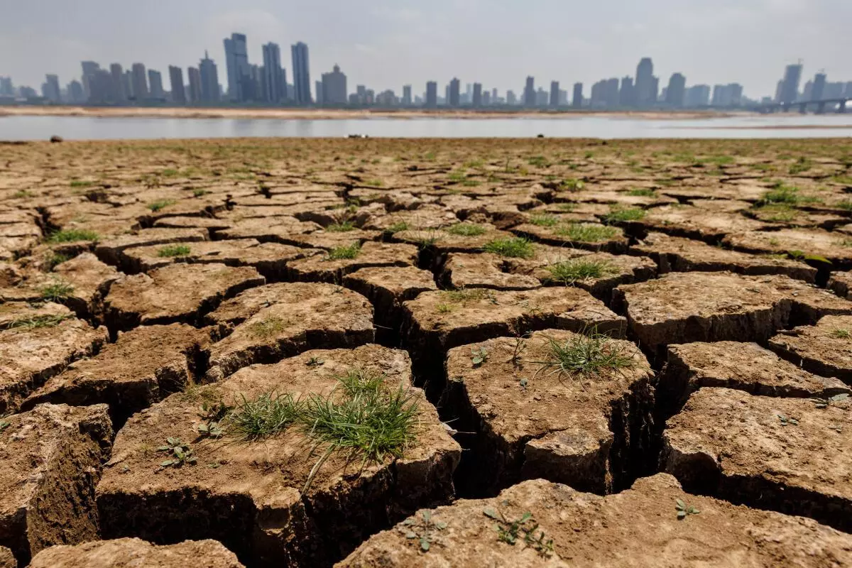 Cracks run through the partially dried-up river bed of the Gan River, a tributary to Poyang Lake during a regional drought in Nanchang, Jiangxi province, China, August 28, 2022. REUTERS