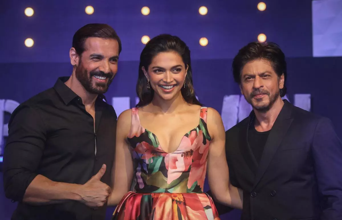 File picture: Pathaan stars John Abraham, Deepika Padukone and Shah Rukh Khan at a promotional event for the film.