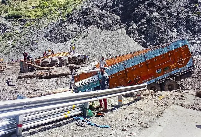 Trucks stranded as the Srinagar-Jammu National Highway was blocked after landslide due to rains, in Banihal sector, Thursday, June 23, 2022. (PTI) Trucks stranded as the Srinagar-Jammu National Highway was blocked after landslide due to rains, in Banihal sector, Thursday, June 23, 2022. (PTI)