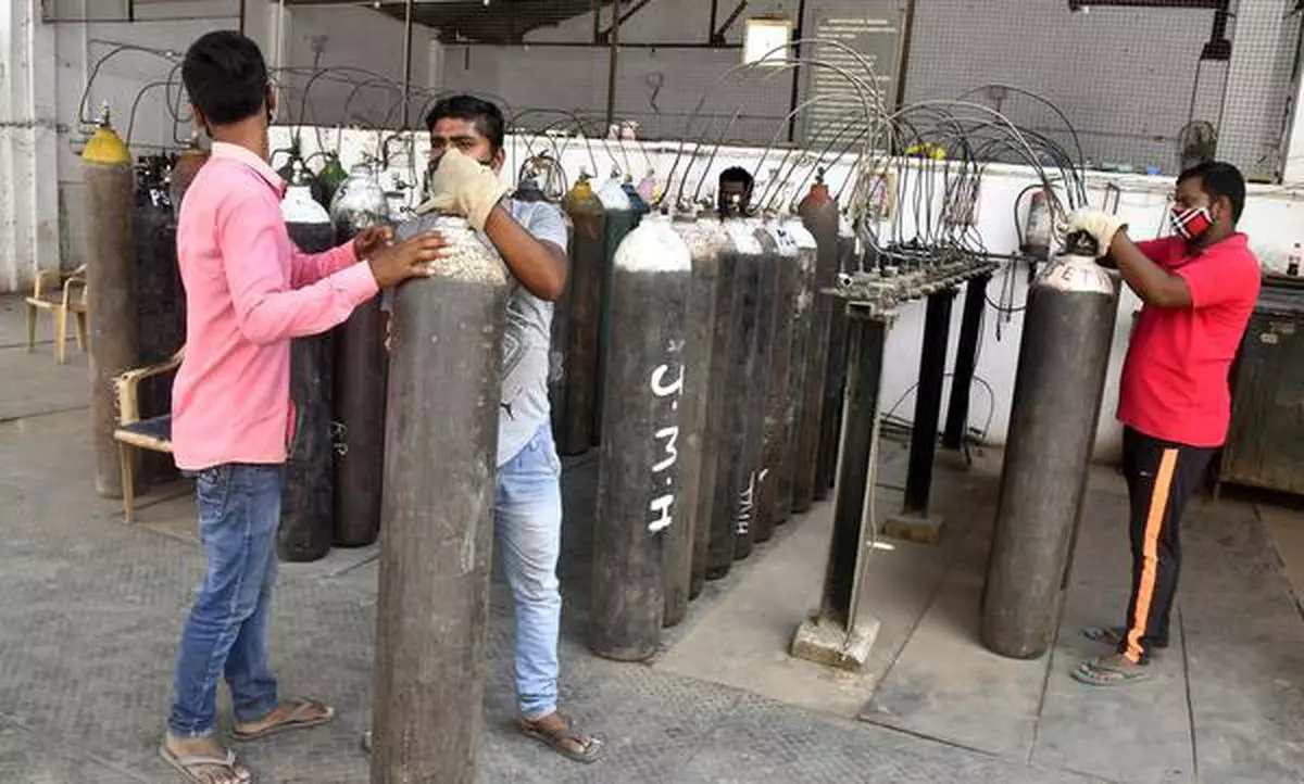 NEW DELHI, 06/05/2021: Workers refilling medical oxygen cylinders for COVID-19, patients at Maya Puri Plant, during the second wave of coronavirus pandemic in West Delhi on Thursday. May 6, 2021. Photo: SHIV KUMAR PUSHPAKAR /The Hindu