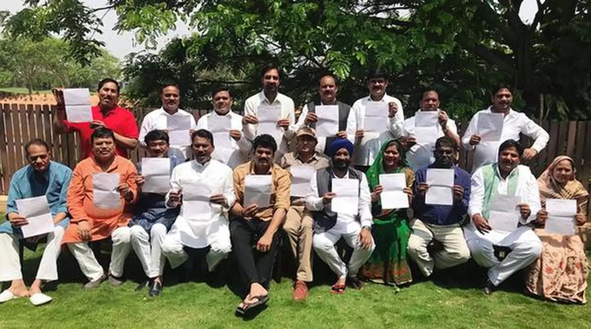 Rebel congress MLAs from Madhya Pradesh pose with  their resignation letters in Bengaluru


