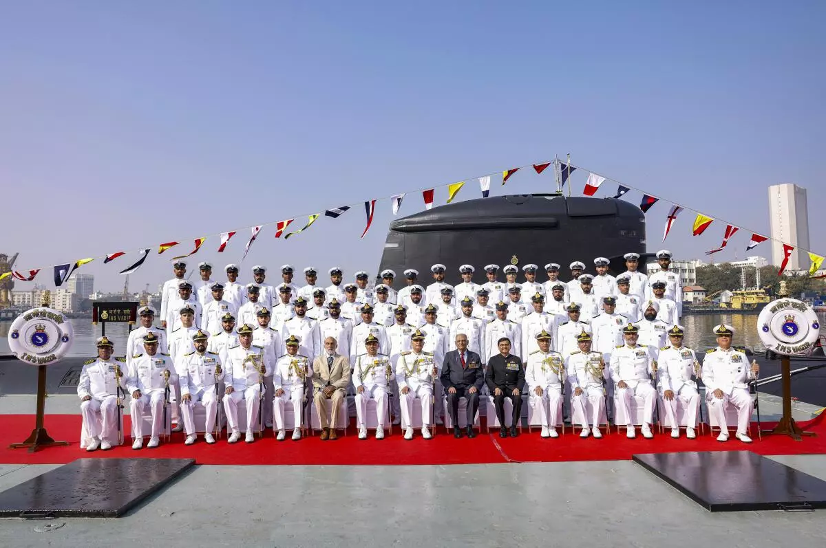 Chief of the Naval Staff Admiral R Hari Kumar with other dignitaries in a group photo at the commissioning ceremony of Indian Navy’s fifth stealth Scorpene class Submarine INS Vagir into the Indian Navy, at the Naval Dockyard in Mumbai, Monday, January 23, 2023. (PTI Photo)