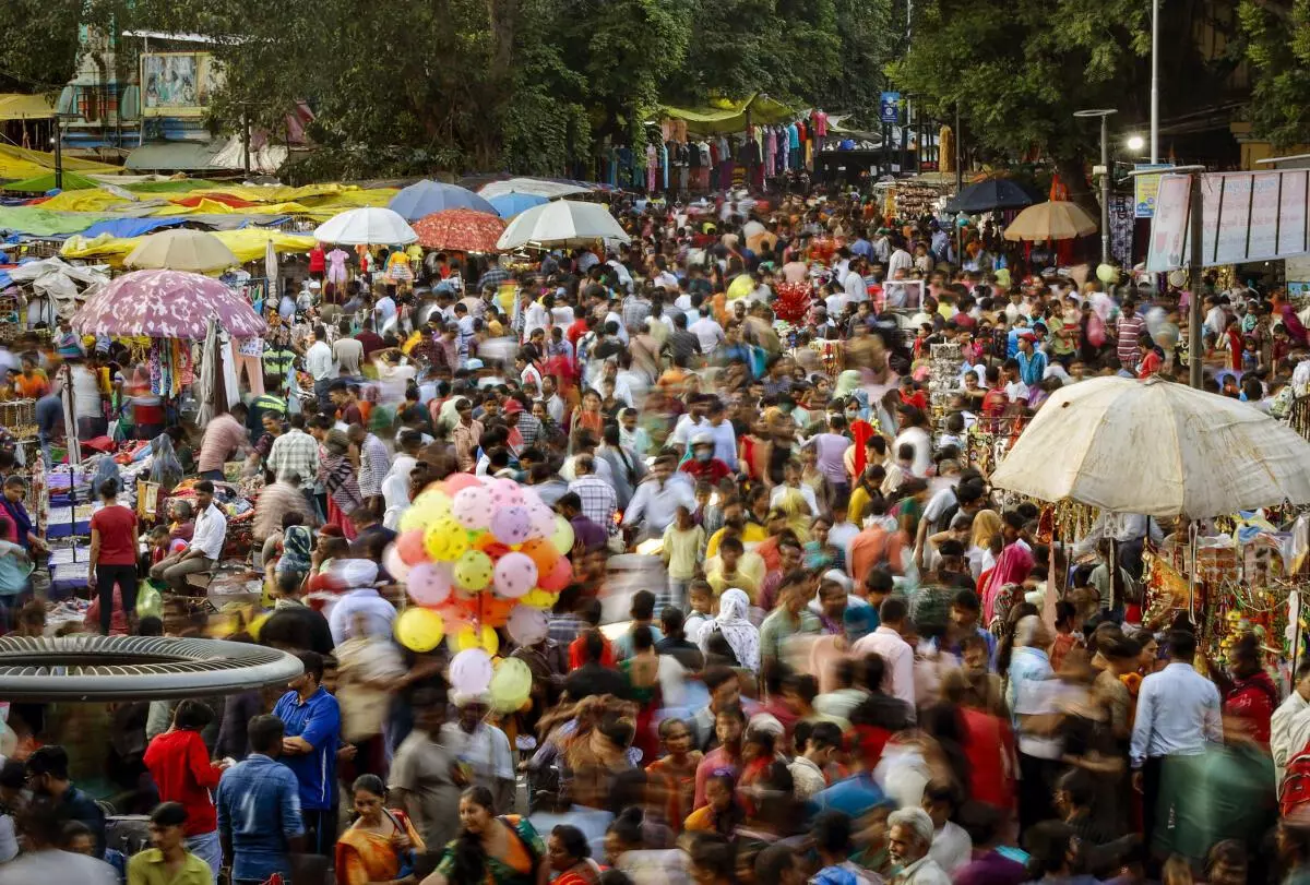 People throng a market for shopping ahead of the Diwali festival, in Ahmedabad, Sunday, October 16, 2022. (PTI)