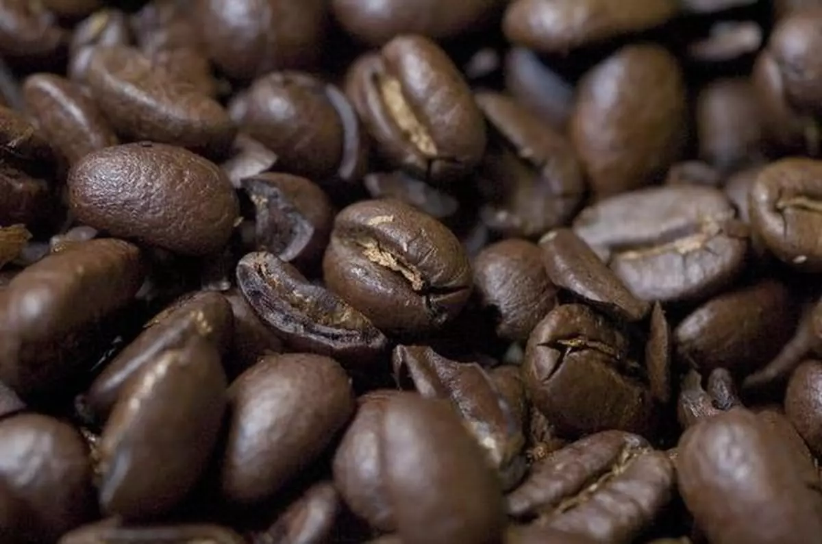 Coffee beans are set up for a photograph in a Starbucks store in New York on December 30, 2004. Coffee prices may rise to a six-year high in 2005 after outpacing major commodities this year, a Bloomberg survey found. Smaller crops in Brazil and the growing appetite for lattes may spur the increase. Photographer: Daniel Acker/Bloomberg News.