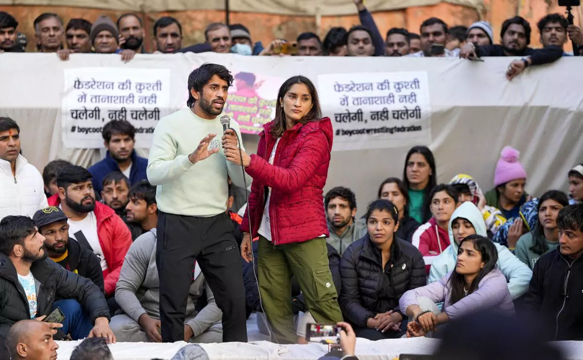 Wrestlers Bajrang Punia, Vinesh Phogat, Sakshi Malik and others during their ongoing protest against the Wrestling Federation of India (WFI), at Jantar Mantar in New Delhi, Friday, January 20, 2023. (PTI Photo)