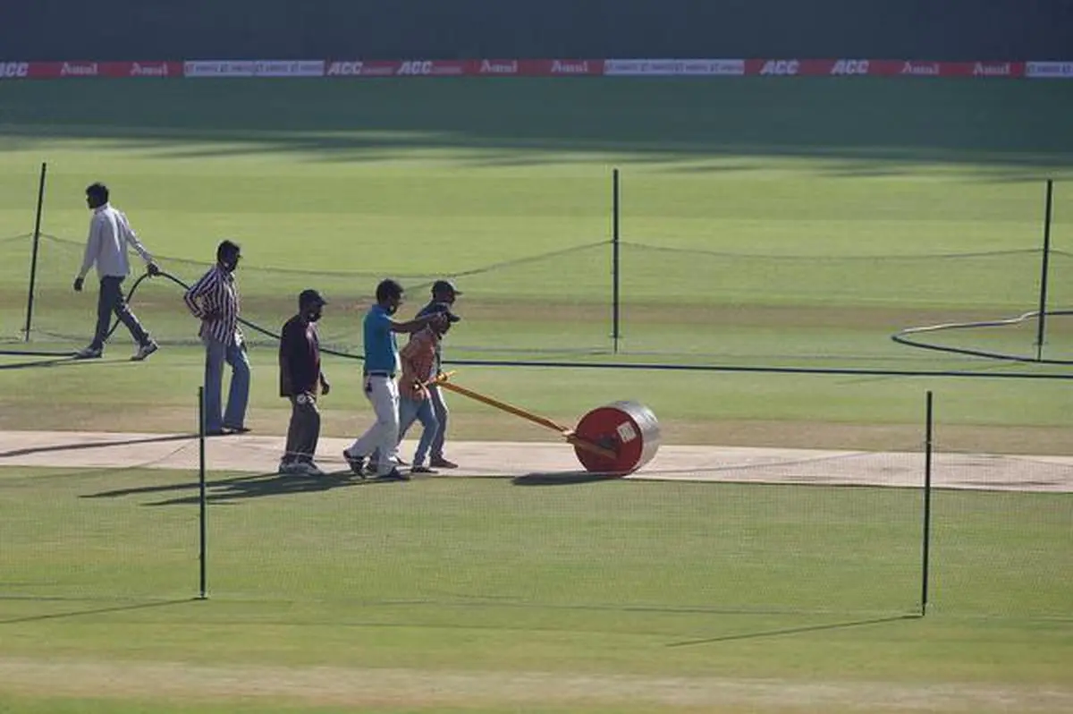 Cricket - Practice Session - Narendra Modi Stadium, Ahmedabad, India - March 3, 2021. Groundsmen prepare a pitch ahead of the fourth test match between India and England. REUTERS/Amit Dave