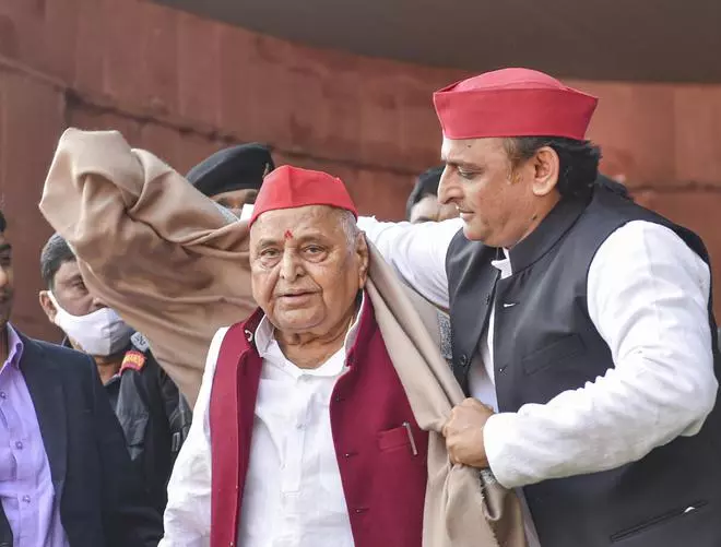 Samajwadi Party president and son Akhilesh Yadav felicitates party’s founder Mulayam Singh Yadav on his birthday, at party office in Lucknow, Monday, November 22, 2021 (PTI/File photo)