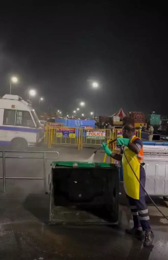 A worker cleaning the bin on Sunday night