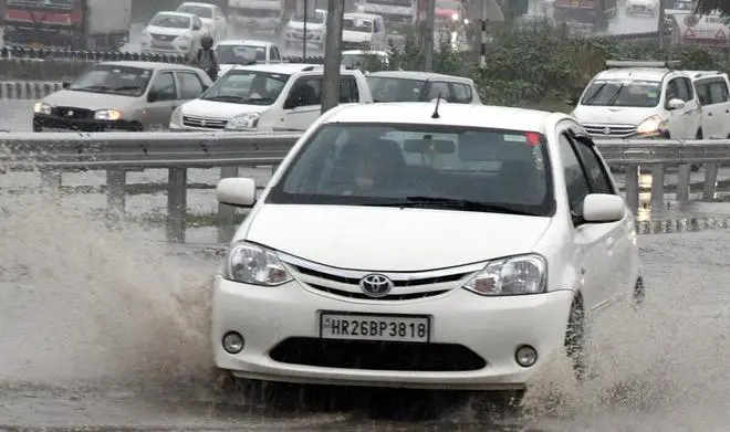 The IMD has issued an ‘orange alert’, cautioning people about sporadic heavy rain. A scene at the Delhi-Jaipur Highway at Gurugram (Kamal Narang) The IMD has issued an ‘orange alert’, cautioning people about sporadic heavy rain. A scene at the Delhi-Jaipur Highway at Gurugram (Kamal Narang)