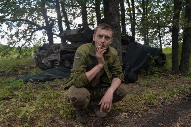 A Ukrainian service member smokes in front of a tank at a position, as Russia’s attack on Ukraine continues, in Kharkiv region, Ukraine July 23, 2022. REUTERS A Ukrainian service member smokes in front of a tank at a position, as Russia’s attack on Ukraine continues, in Kharkiv region, Ukraine July 23, 2022. REUTERS