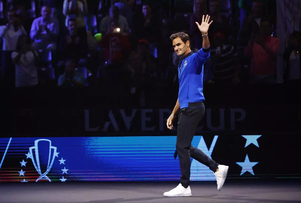 Roger Federer walks out ahead of Matteo Berrettini’s match against Team World’s Felix Auger Aliassime (Reuters)