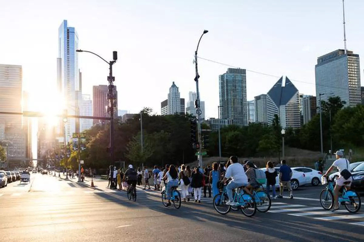 People ride bike in Chicago, Illinois, US, September 5