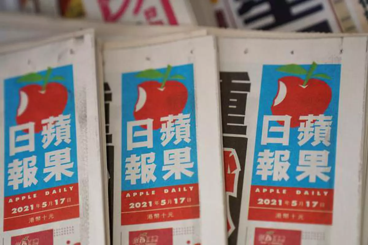 FILE PHOTO: Copies of Next Digital's Apple Daily newspapers are seen at a newsstand in Hong Kong, China May 17, 2021. REUTERS/Lam Yik/File Photo