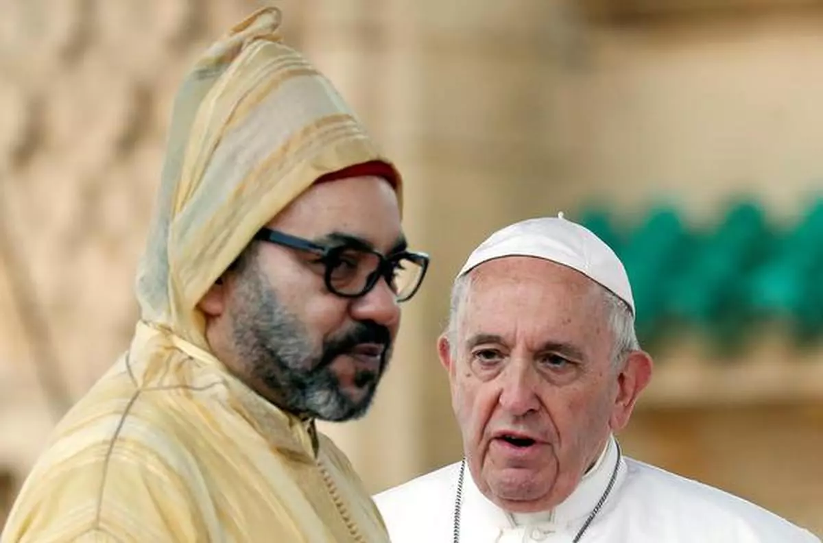 Pope Francis talks to King Mohammed VI at the Hassan Tower esplanade in Rabat, Morocco
