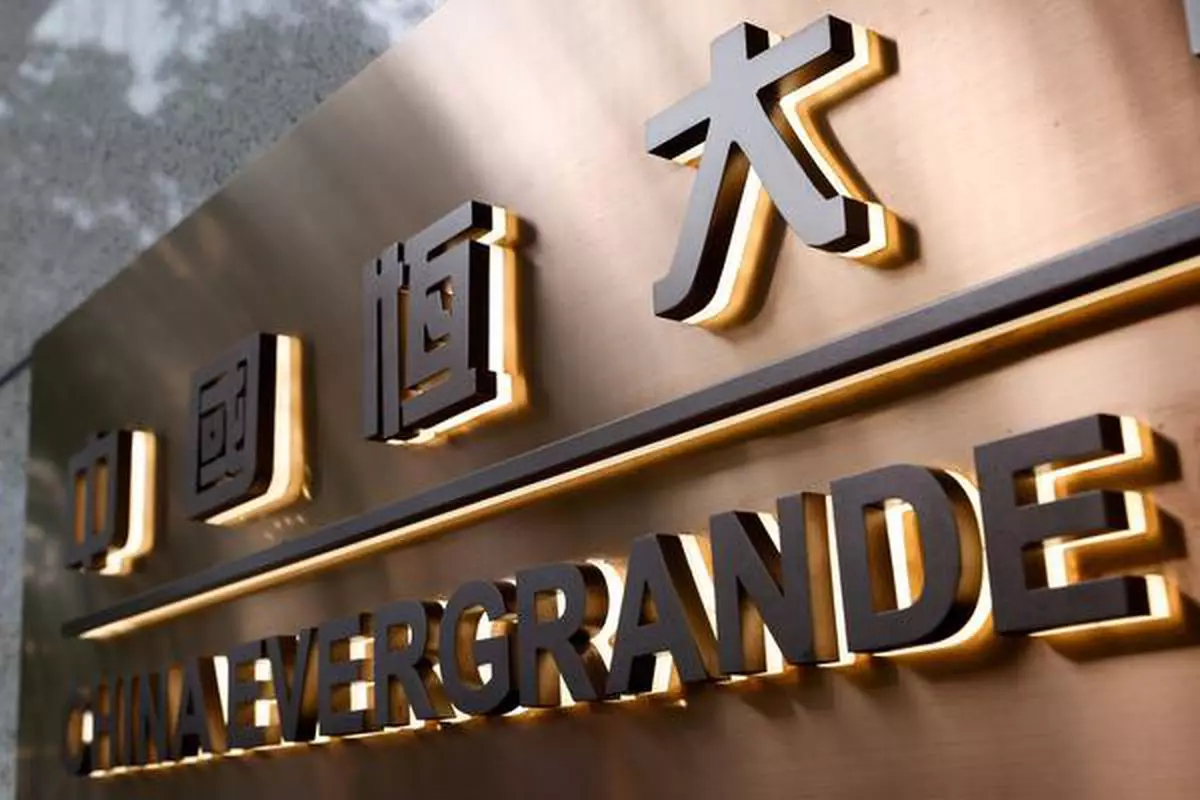 FILE PHOTO: The China Evergrande Centre building sign is seen in Hong Kong, China, September 23, 2021. REUTERS/Tyrone Siu//File Photo