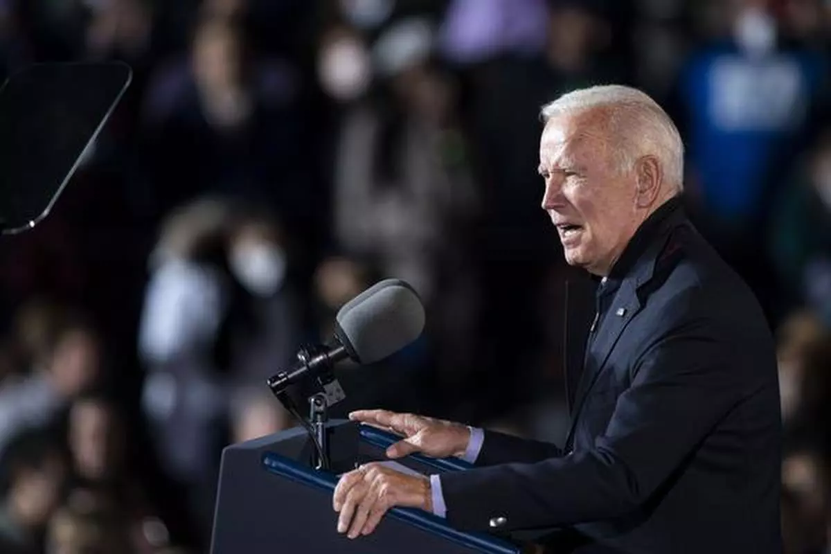 U.S. President Joe Biden speaks during a campaign event for Terry McAuliffe, Democratic gubernatorial candidate for Virginia, in Arlington, Virginia, U.S., on Tuesday, Oct. 26, 2021. McAuliffe, a former Virginia governor is locked in a dead heat with Glenn Youngkin, a former co-chief executive officer ofCarlyle Group Inc., ahead of next week's election. Photographer: Al Drago/Bloomberg