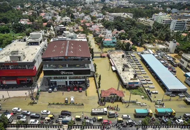 An aerial view of flooded Rainbow Drive Layout after heavy monsoon rains at Sarjapur, in Bengaluru, Monday, September 5, 2022. (PTI) An aerial view of flooded Rainbow Drive Layout after heavy monsoon rains at Sarjapur, in Bengaluru, Monday, September 5, 2022. (PTI)