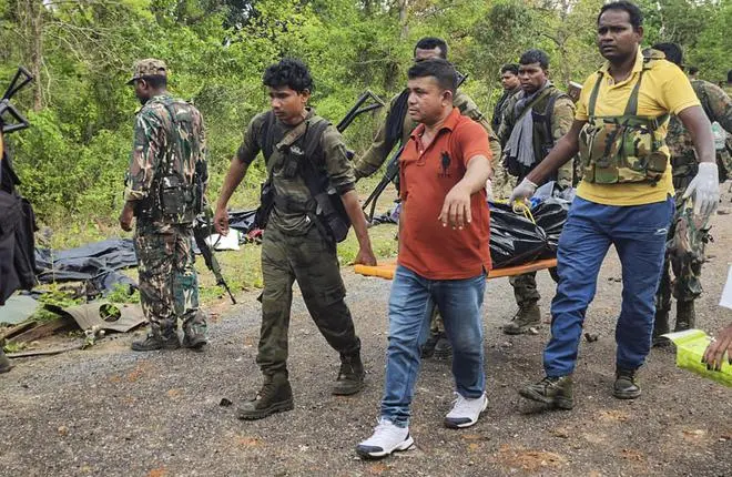 Rescue team members carry the body of a security personnel who was killed in a blast carried out by Naxalites in Chhattisgarh‘s Dantewada district, Wednesday, April 26, 2023. (PTI Photo) Rescue team members carry the body of a security personnel who was killed in a blast carried out by Naxalites in Chhattisgarh‘s Dantewada district, Wednesday, April 26, 2023. (PTI Photo)