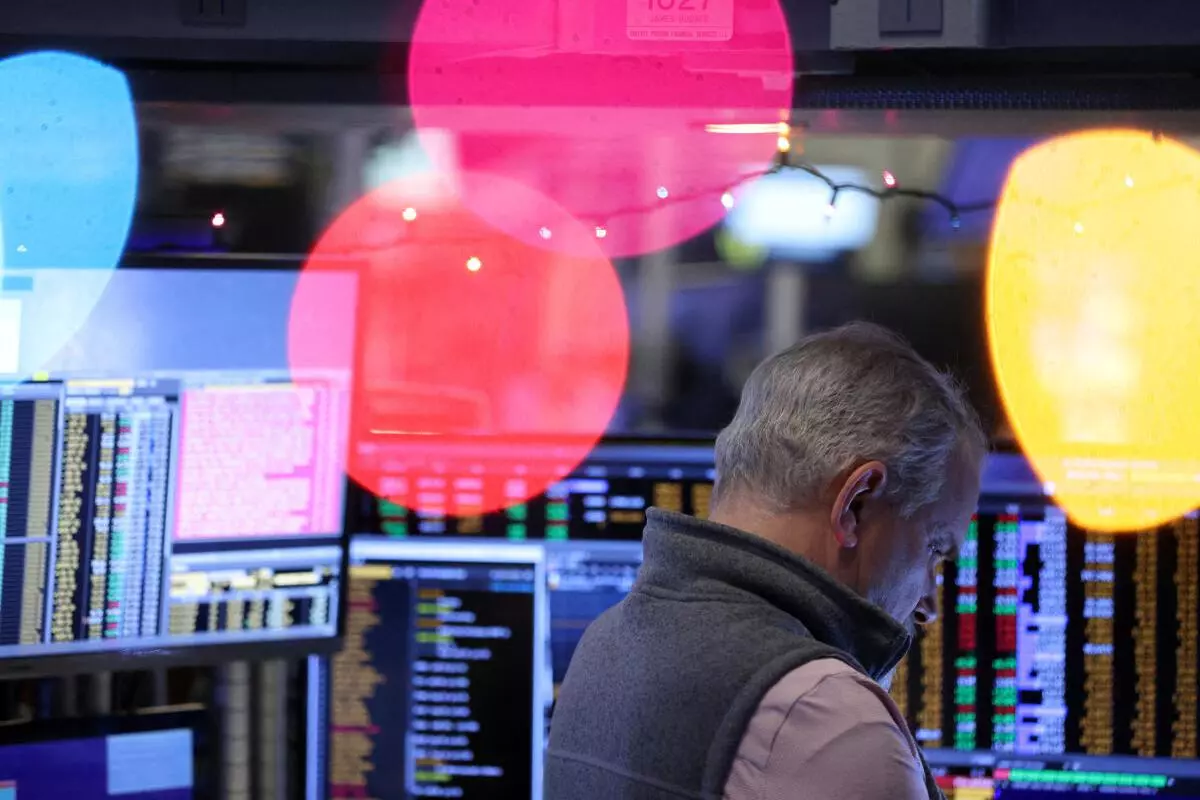 A trader works on the trading floor at the New York Stock Exchange (NYSE) in New York City, US, December 14, 2022. REUTERS