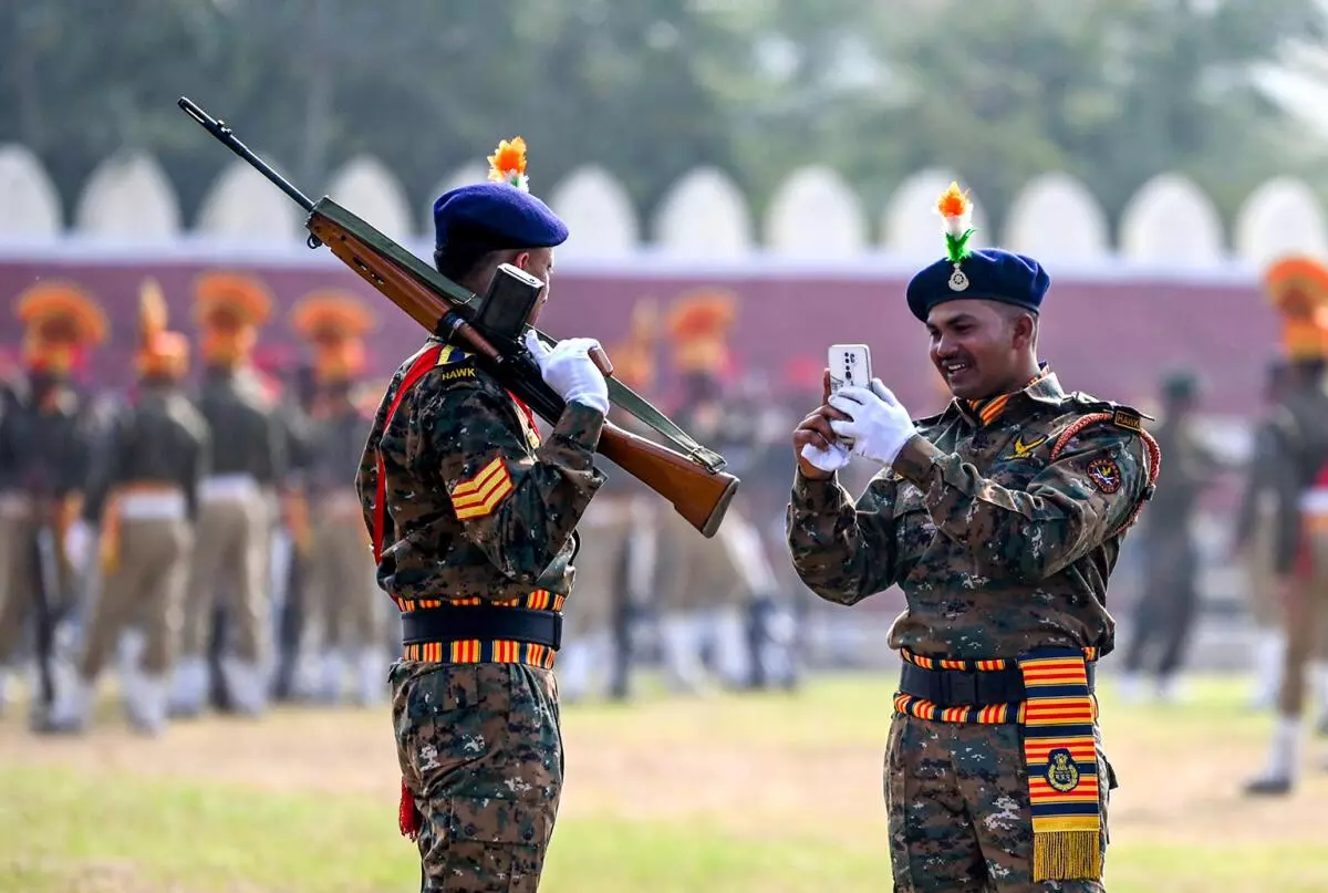 Police jawan posing for photographs after Full Dress rehearsal of Republic Day parade at Lal Parade Ground in Bhopal. (Photo: AM FARUQUI/The Hindu)