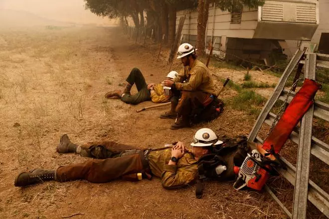 Klamath Interagency Hotshots rest while waiting for a new assignment as the McKinney Fire burns near Yreka, California, US, July 31, 2022. REUTERS