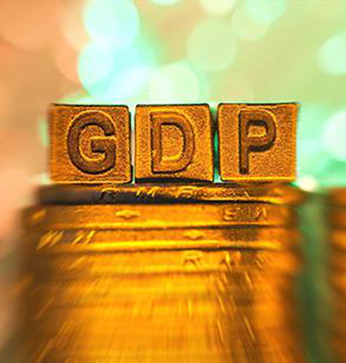 GDP copper alphabet on coin stack in radial blur illuminated with light