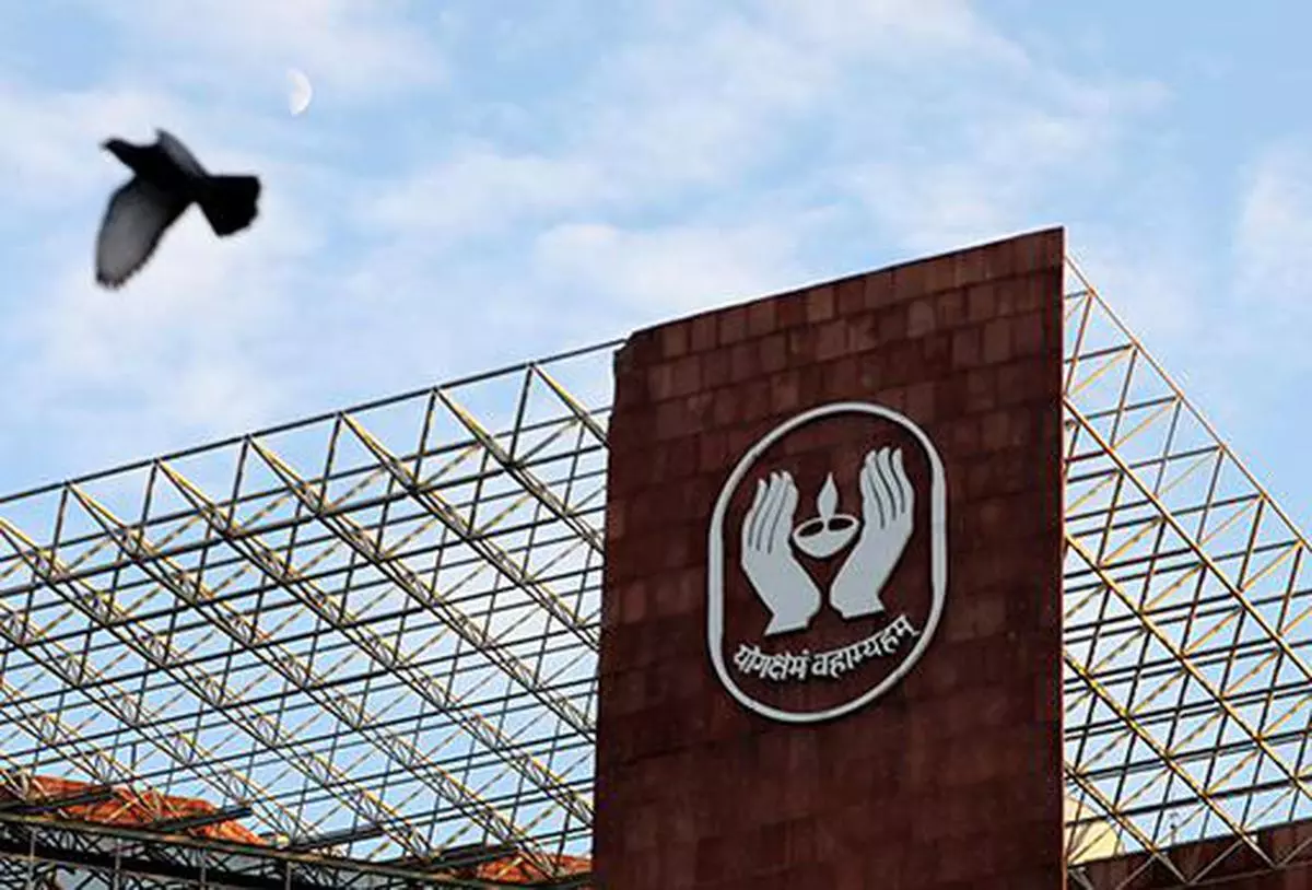 A bird flies past a logo of Life Insurance Corporation of India (LIC) at one of its offices in New Delhi, India September 14, 2021. Picture taken September 14, 2021. REUTERS/Anushree Fadnavis