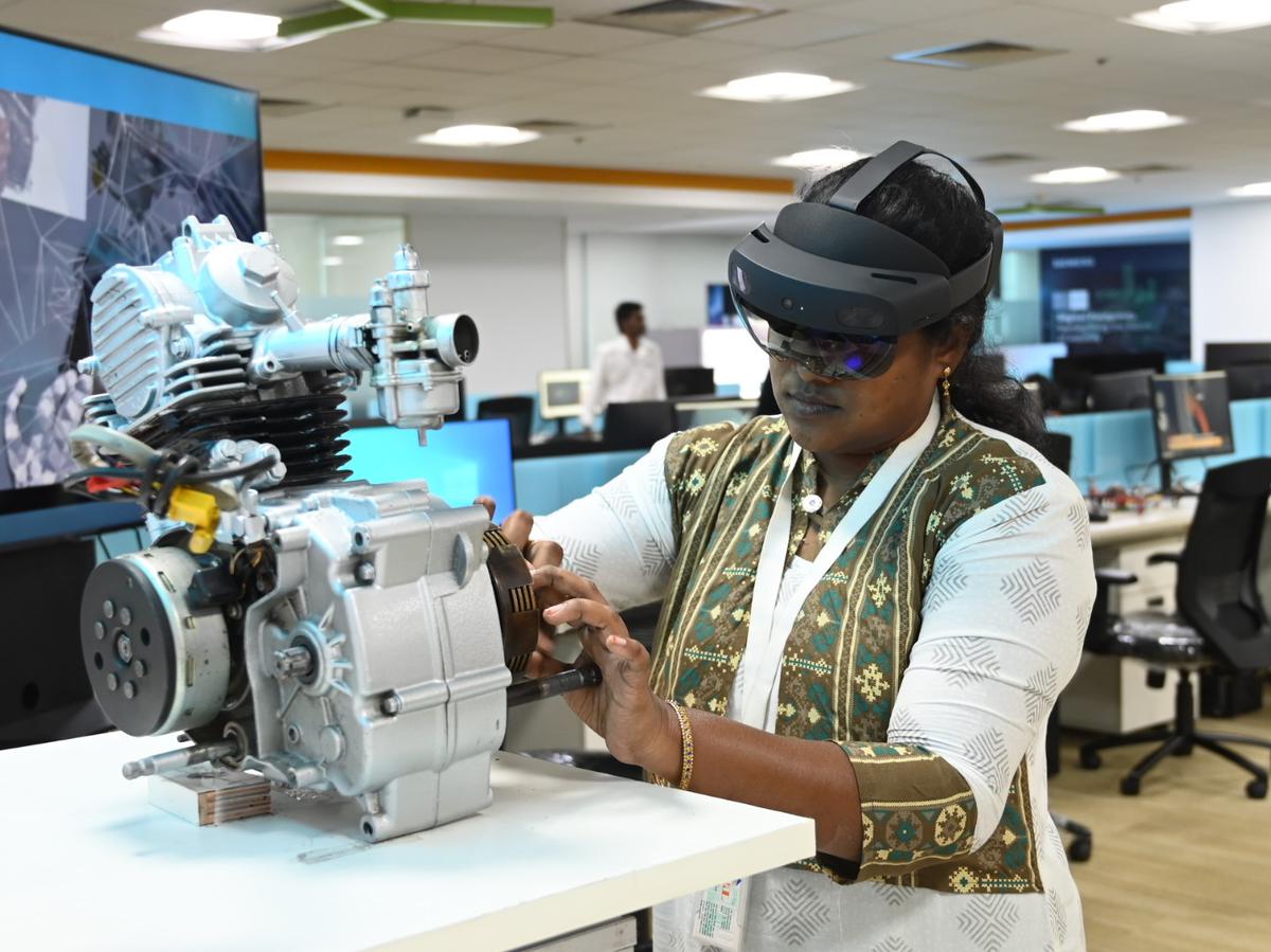 AR engineer Janani Ravichandran performing a simulated maintainence drill guided by the hololens she’s wearing at TANSAM Siemens Centre of Excellence, at the Tidel Park, Chennai. 